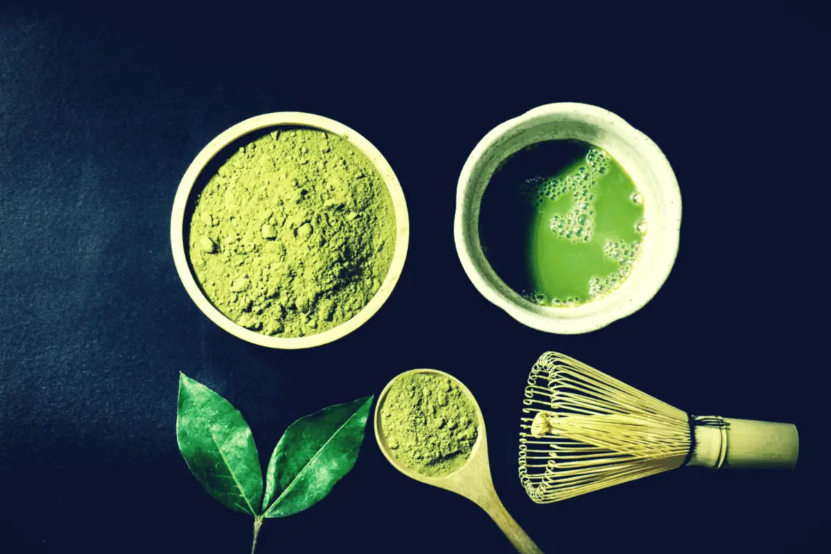 matcha powder tea with whisk and spoon